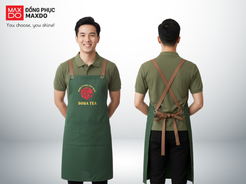 Mẫu đồng phục quán cafe có thiết kế áo thun cổ polo phối cùng tạp dề yếm màu xanh rêu