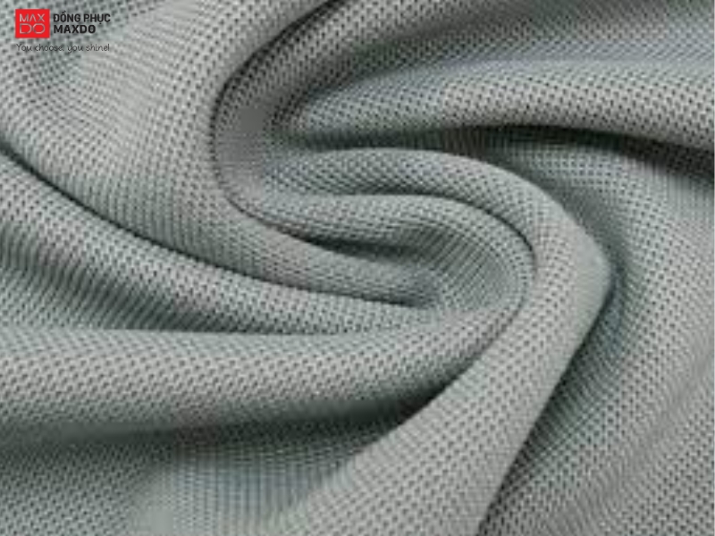 Bề mặt vải thun cá sấu cotton 100%.